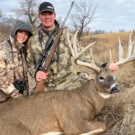 Couple with their deer prize