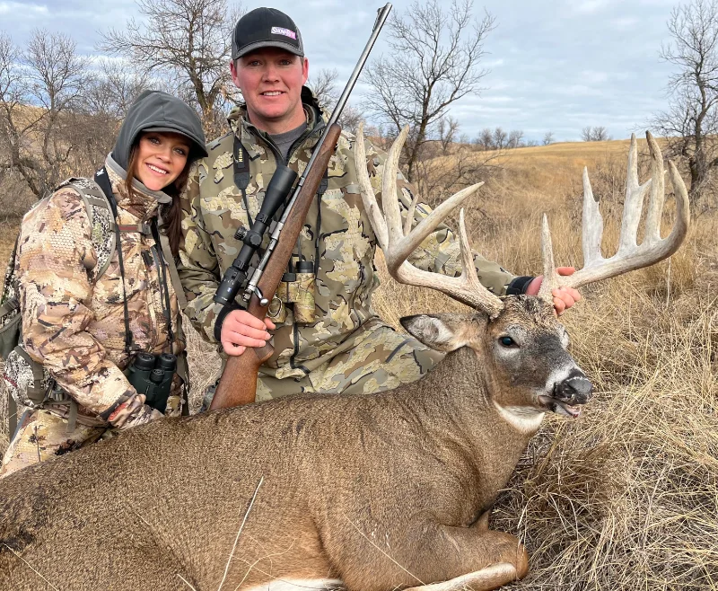 Couple with their deer prize