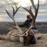 man with elk and large rack